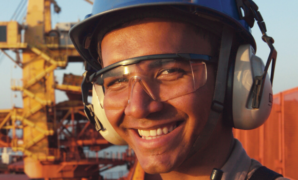 A picture of an Alcoa employee smiling.