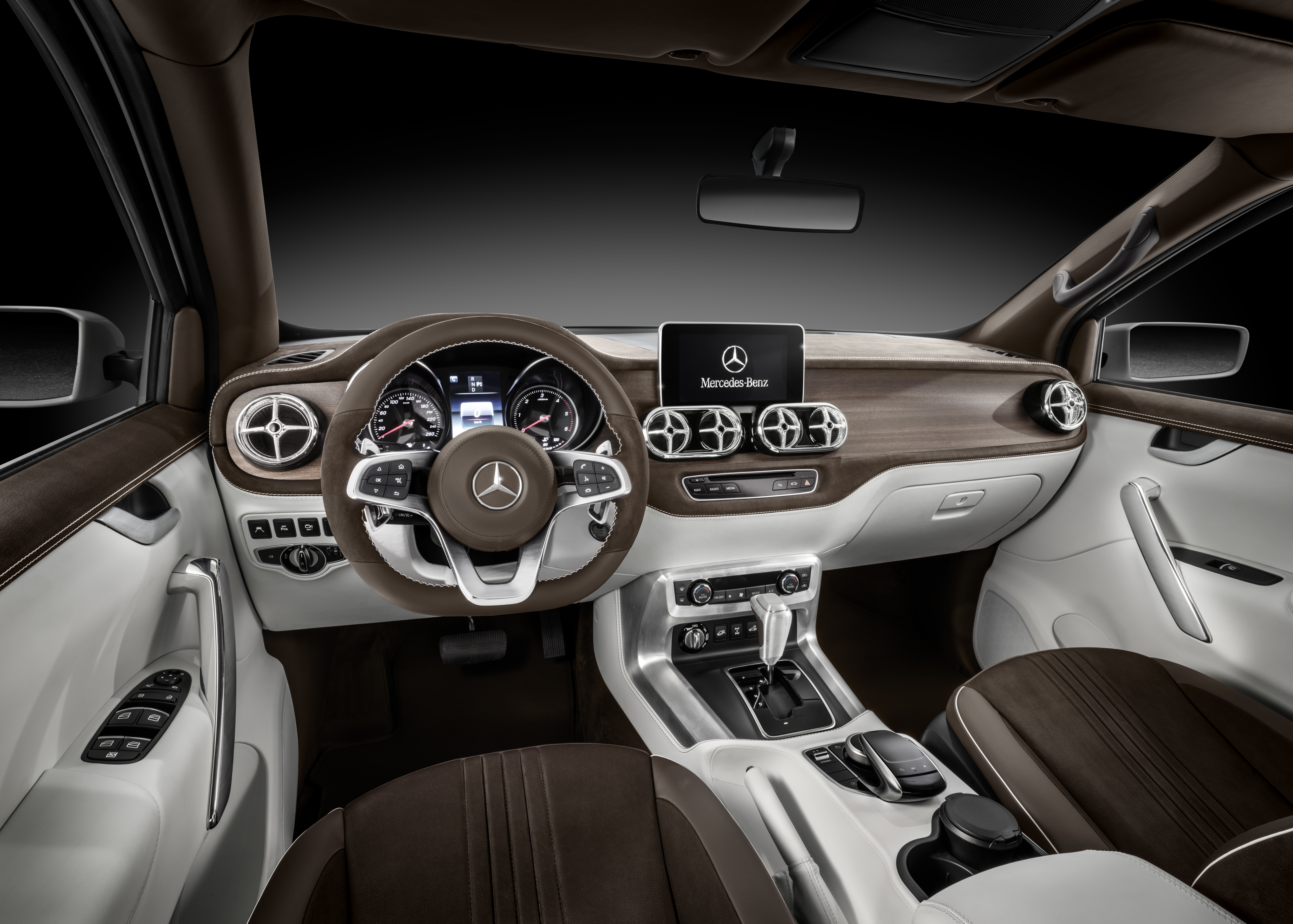 An interior photo showing the dashboard and front seats of the X-Class concept truck.