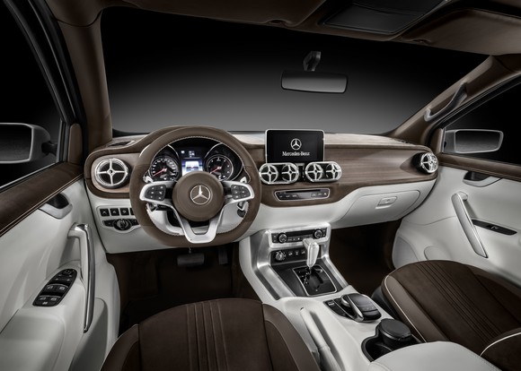 An interior photo showing the dashboard and front seats of the X-Class concept truck.