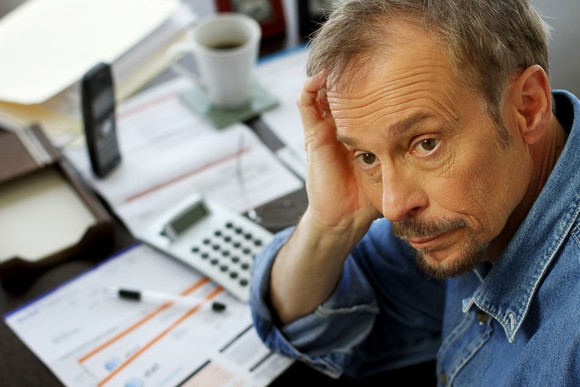 A worried baby boomer struggling with his finances.