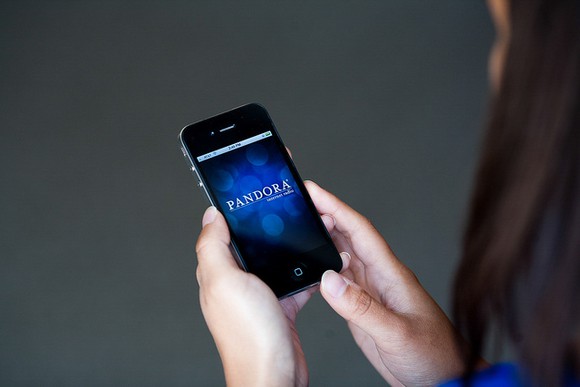 A person using the Pandora app on a smartphone