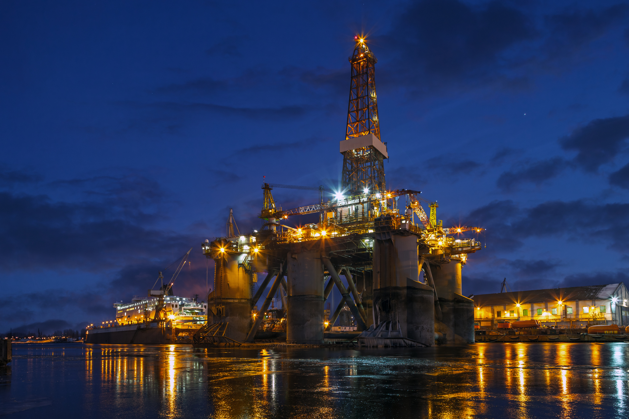 Offshore rig in dockyard at night