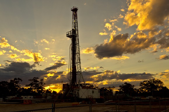 Land drilling rig at sunset