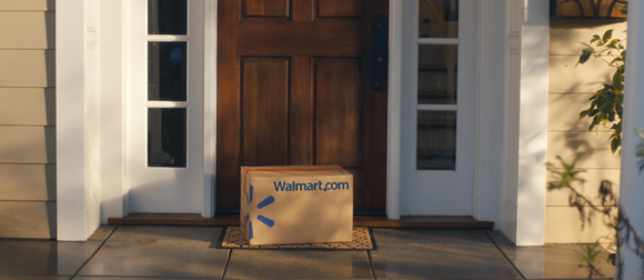 A Wal-Mart box sits on a doorstep.