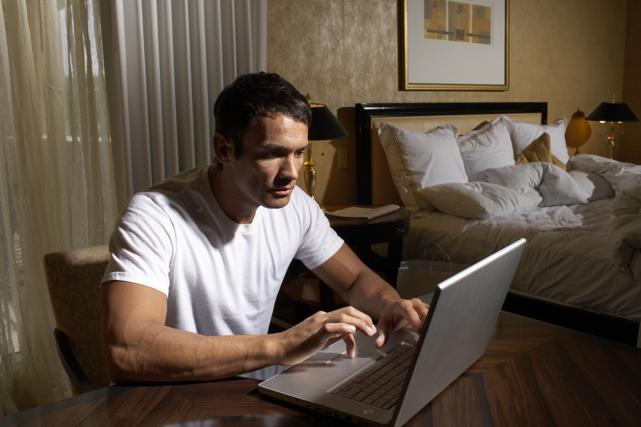 Man on laptop computer.