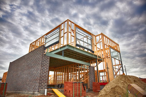 Image of a home under construction on a cloudy day.