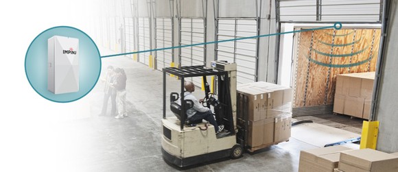 A forklift moving boxes on a pallet