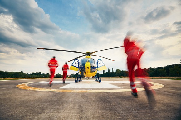 Crew rushing to medevac helicopter.