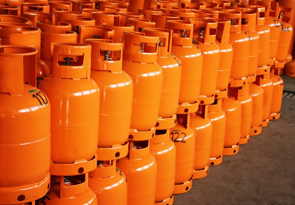 individual stacked orange propane tanks