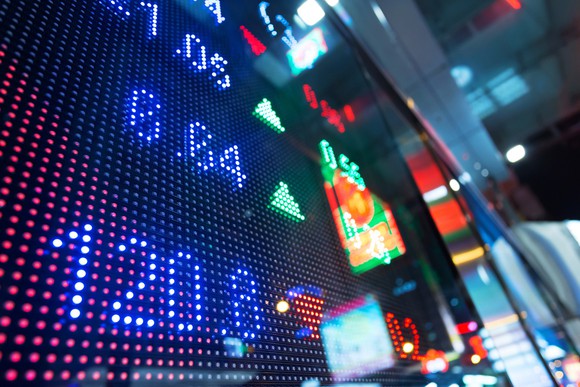 Photo of stock board at NYSE trading floor.