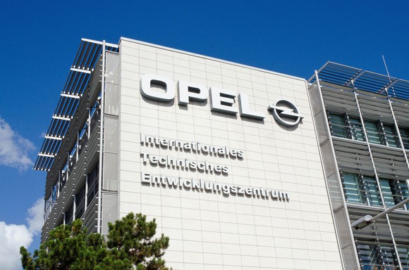 A close-up of the sign on the front of Opel's engineering center.