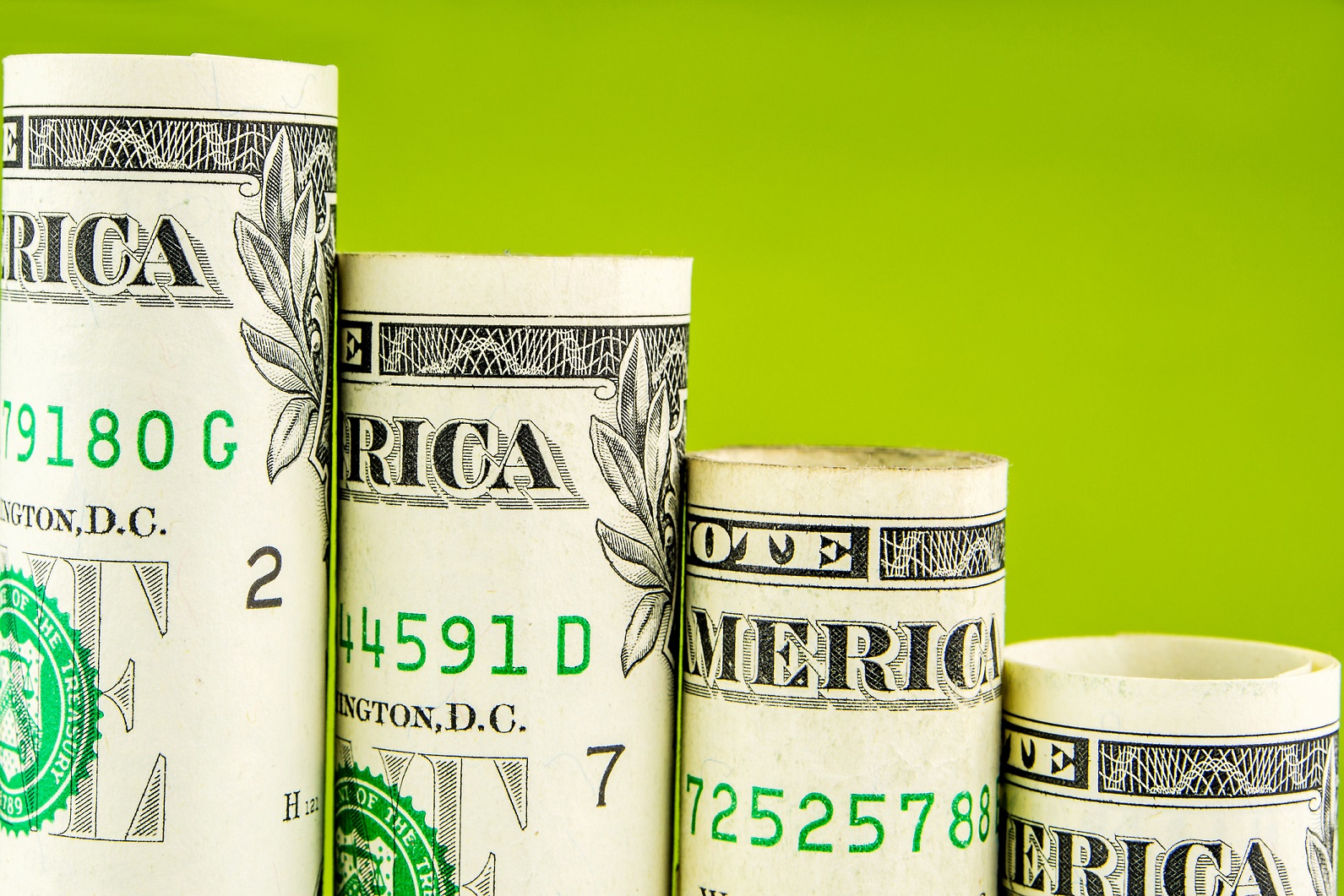 Declining steps made out of rolled up U.S. one dollar bills.