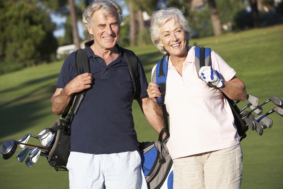 Senior couple playing golf