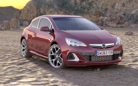 An Opel car park on sand.