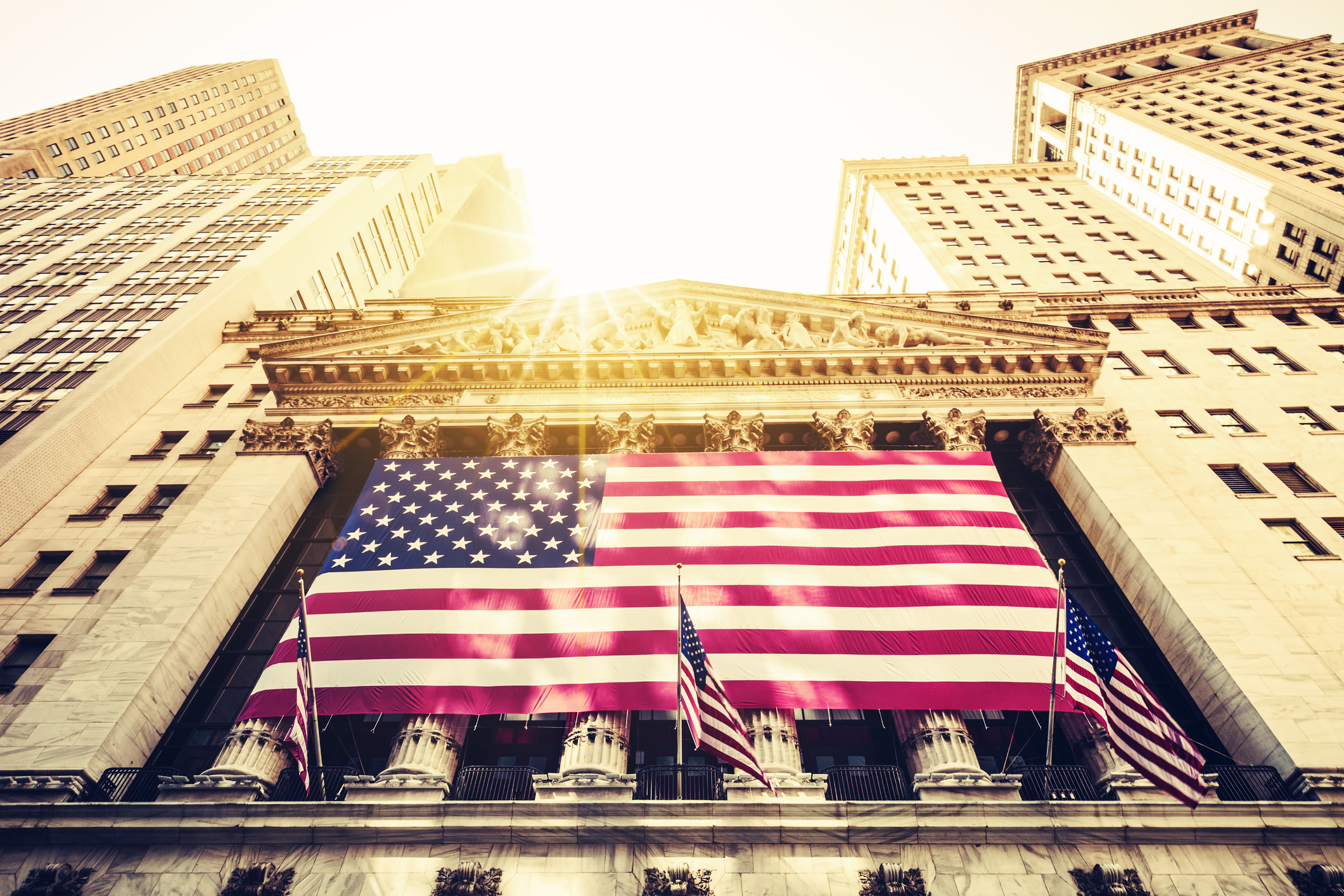 The sun shining above the New York Stock Exchange.