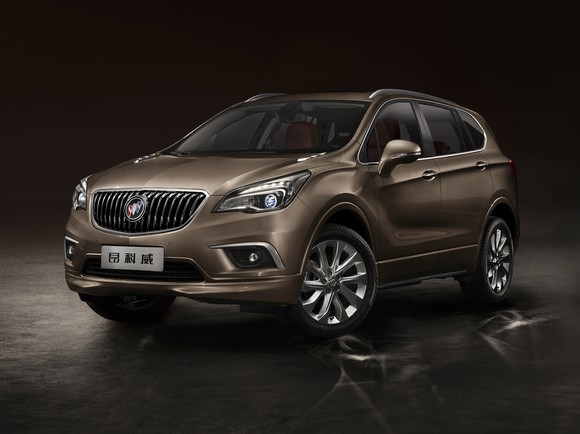 A Chinese-market version of the midsize Buick Envision SUV, in tan against a dark background.