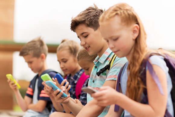 Children using smartphones.