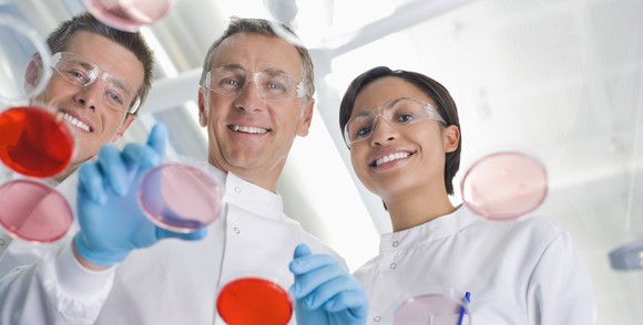 Lab scientists working together on a project.