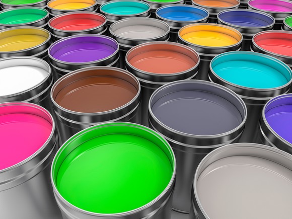 Rows of different colored paint cans.