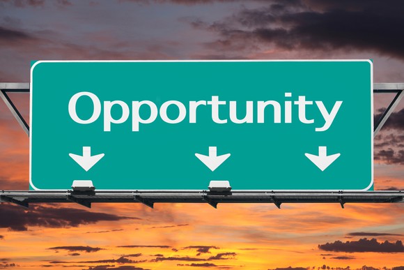 Highway sign saying Opportunity, with arrows pointing ahead