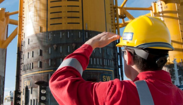 A Royal Dutch Shell employee looking up.