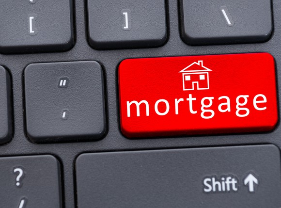 Button of mortgage text on red keyboard in closeup