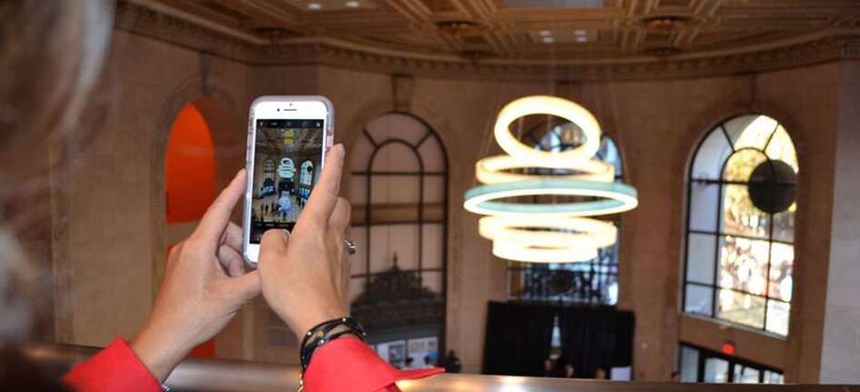 A woman takes a picture in AT&T's flagship store in San Francisco.