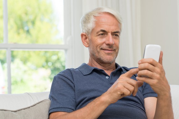 Older man using his phone