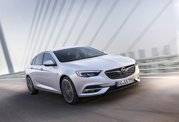 A white 2018 Opel Insignia sedan on the road.
