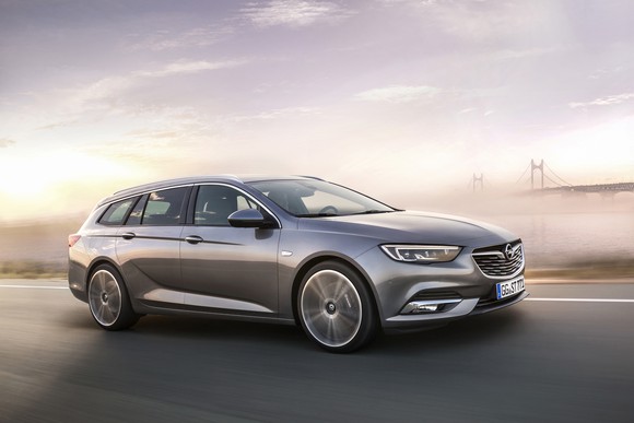 A brown Opel Insignia Sport Tourer station wagon.