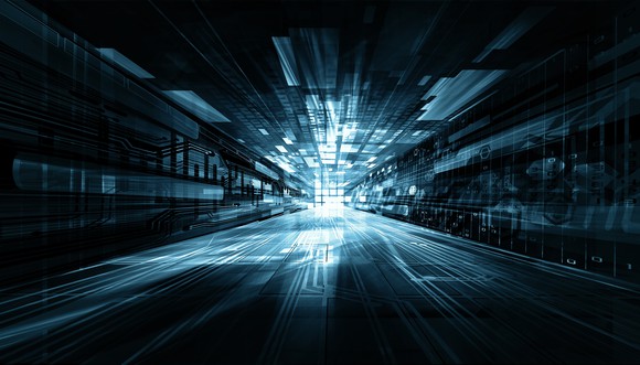 Futuristic picture of the inside of a computer with a light at the end.