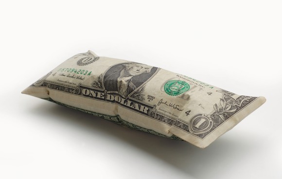 A $1 bill that has been inflated like a balloon