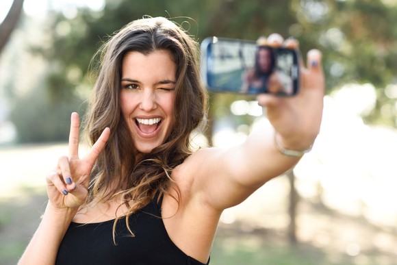 Woman taking a selfie.