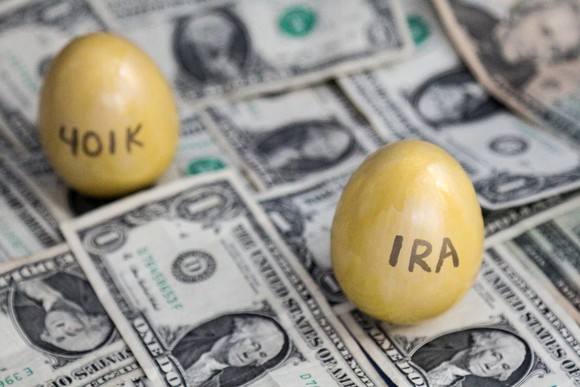 IRA and 401K golden eggs on one dollar bills