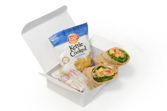 Boxed lunch of airplane food.