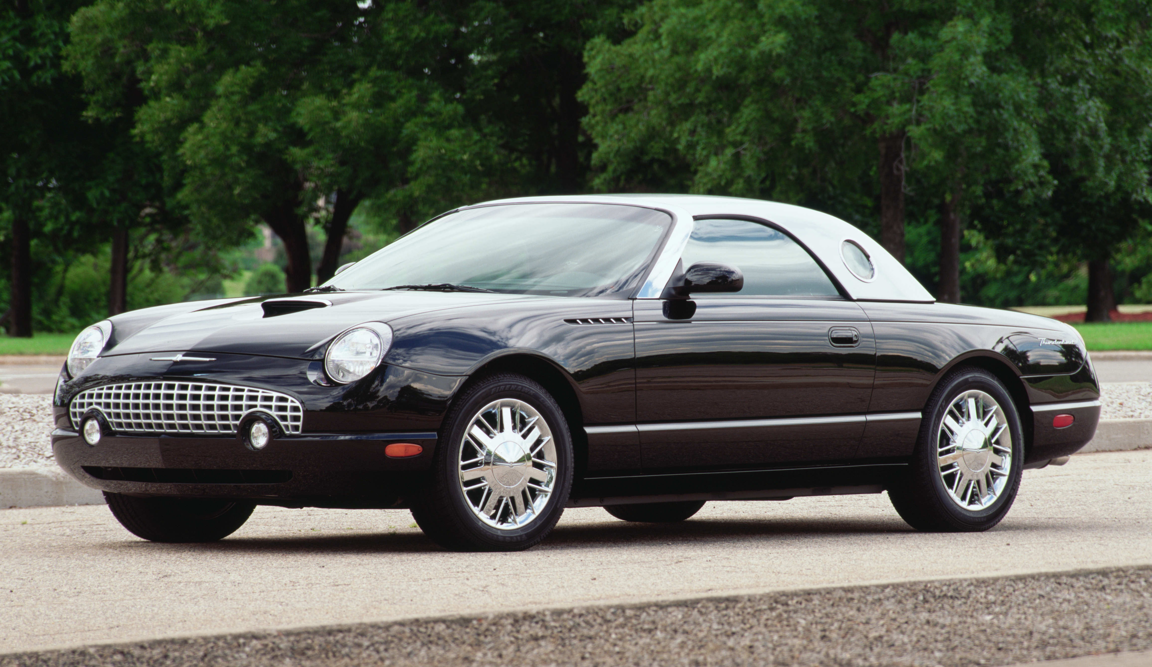 A black 2002 Ford Thunderbird.