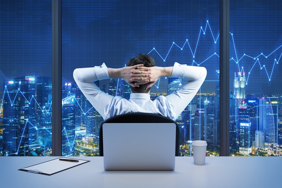 Businessman relaxing while looking at charts