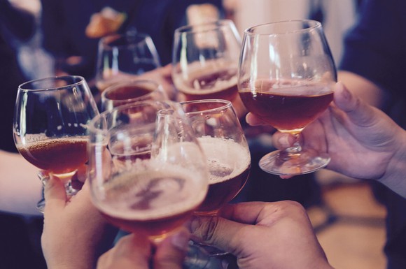 Raised glasses to extend toast or cheer