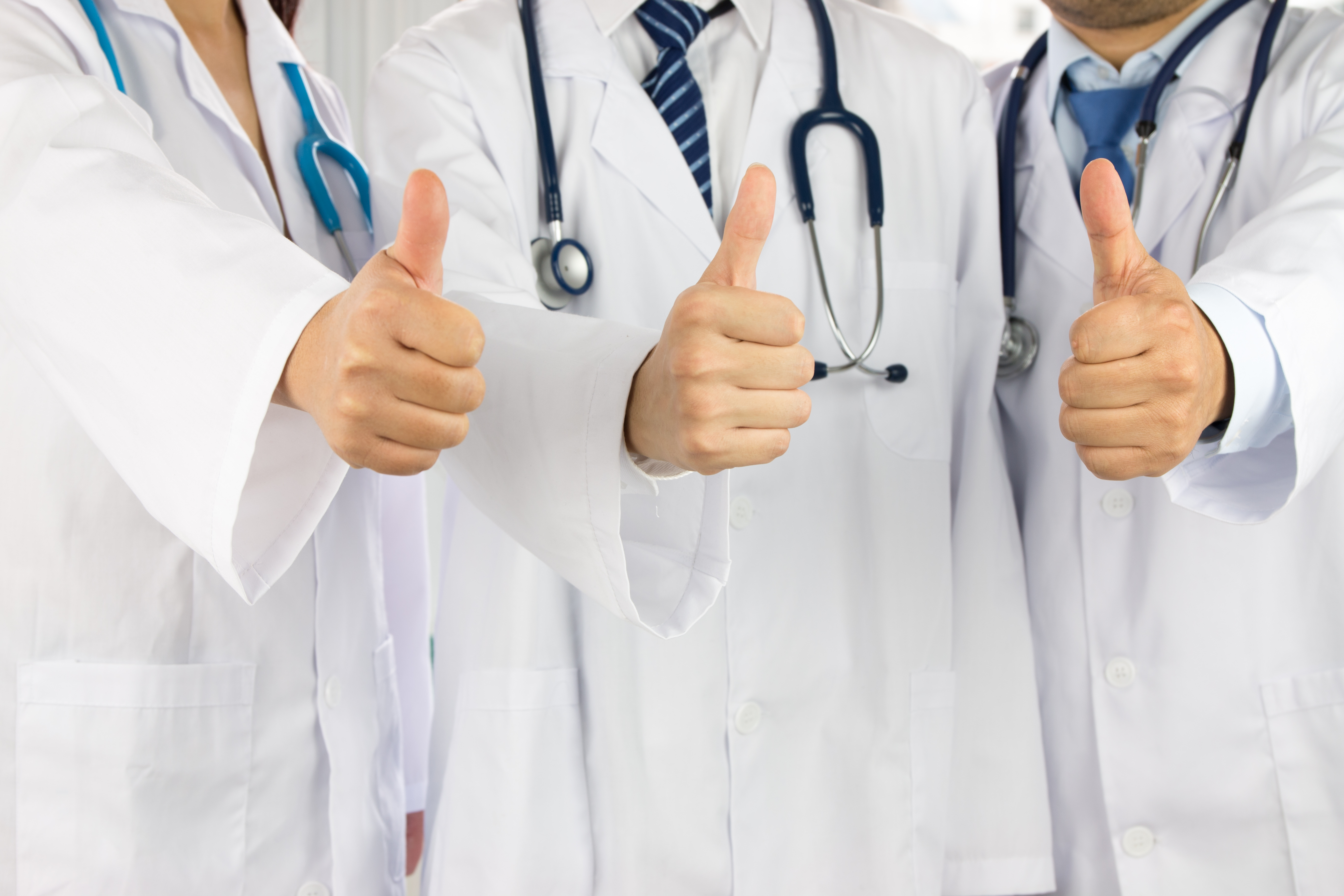 doctors giving the thumbs up