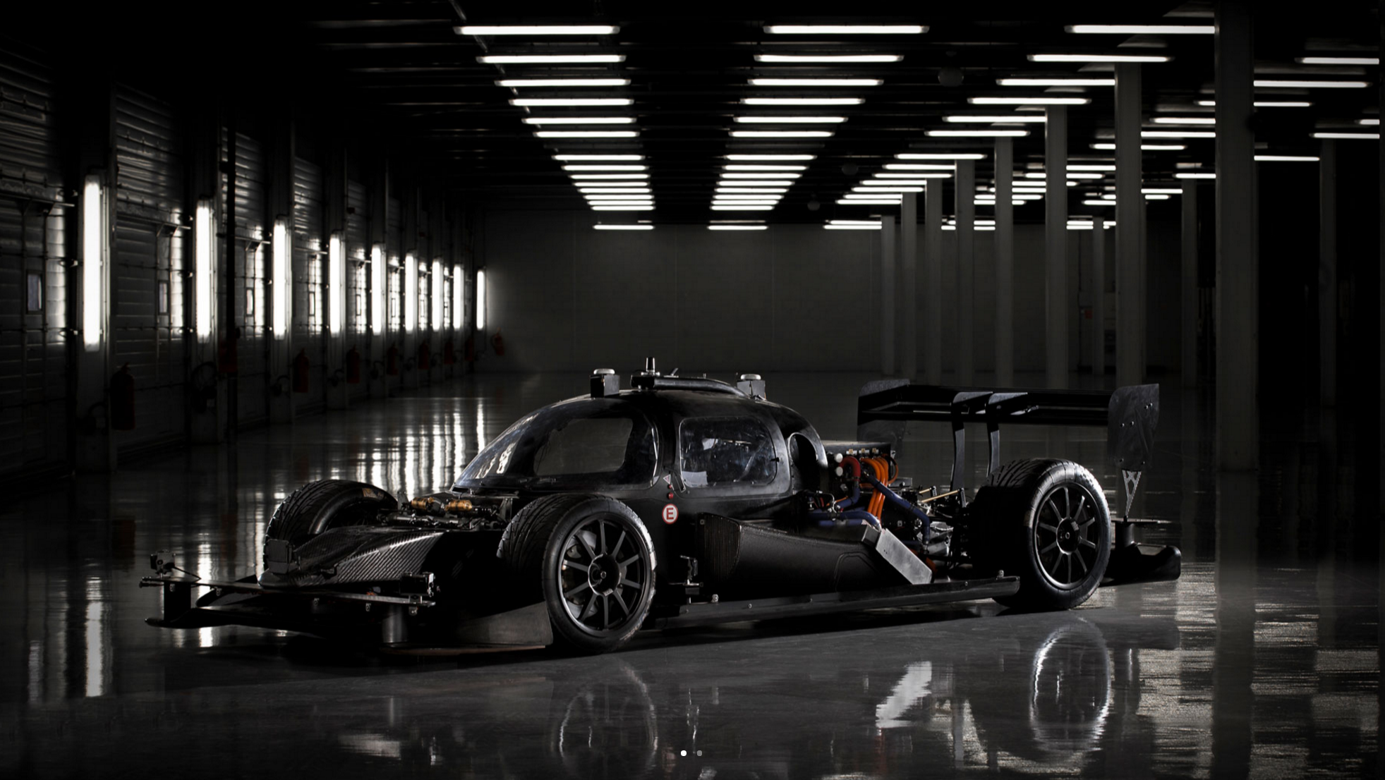A DevBot pictured in black. The car has a cockpit, unlike the Robocar, allowing an engineer to take control and drive if needed.