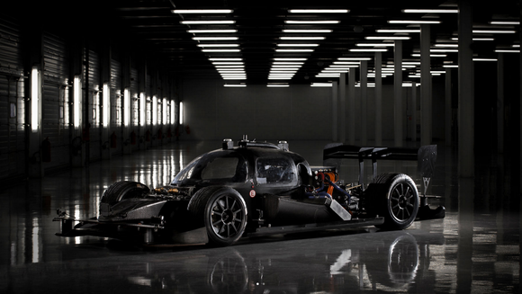 A DevBot pictured in black. The car has a cockpit, unlike the Robocar, allowing an engineer to take control and drive if needed.