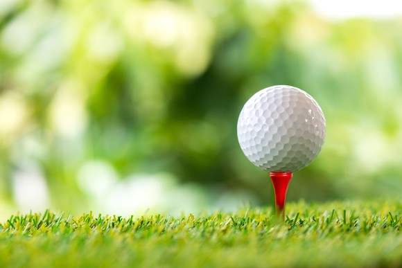 A golf ball on a tee.