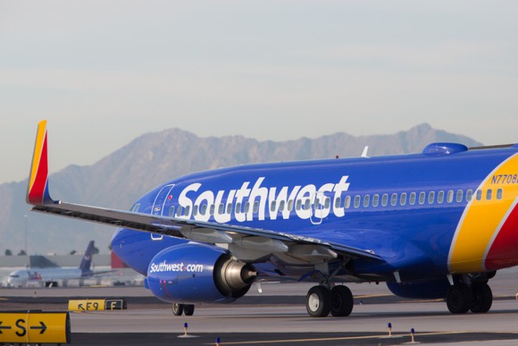 A Southwest Airlines plane taxiing on the runway.