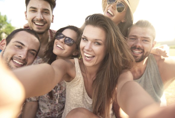 A group of people taking a selfie.