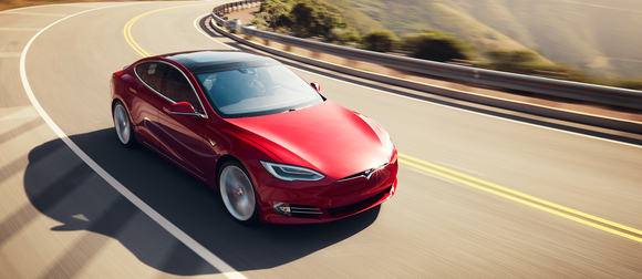 Red Model S driving