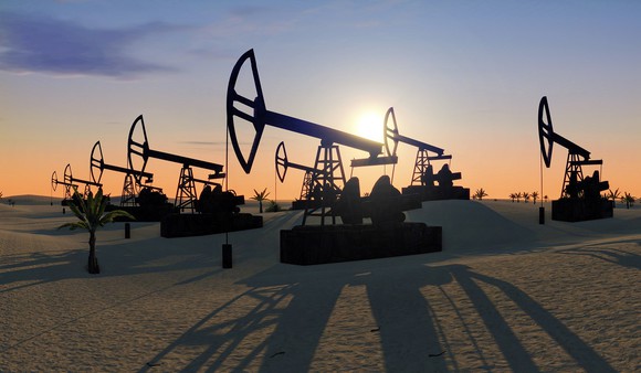 Oil pumpjacks operating in the desert.