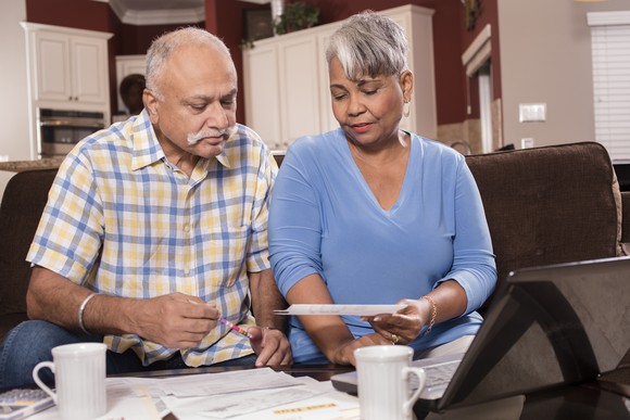 Older couple with bills