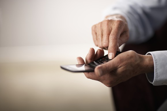 Man holding a flip-phone.