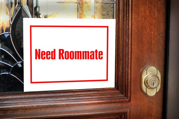 A roommate wanted sign on a door