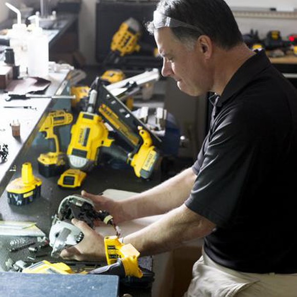 Man looking at Stanley Black & Decker's DeWalt line of tools